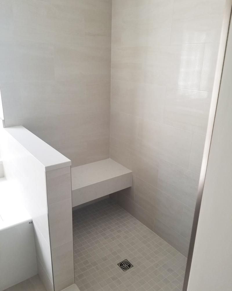 Mixed Tiled Bathroom With Bench