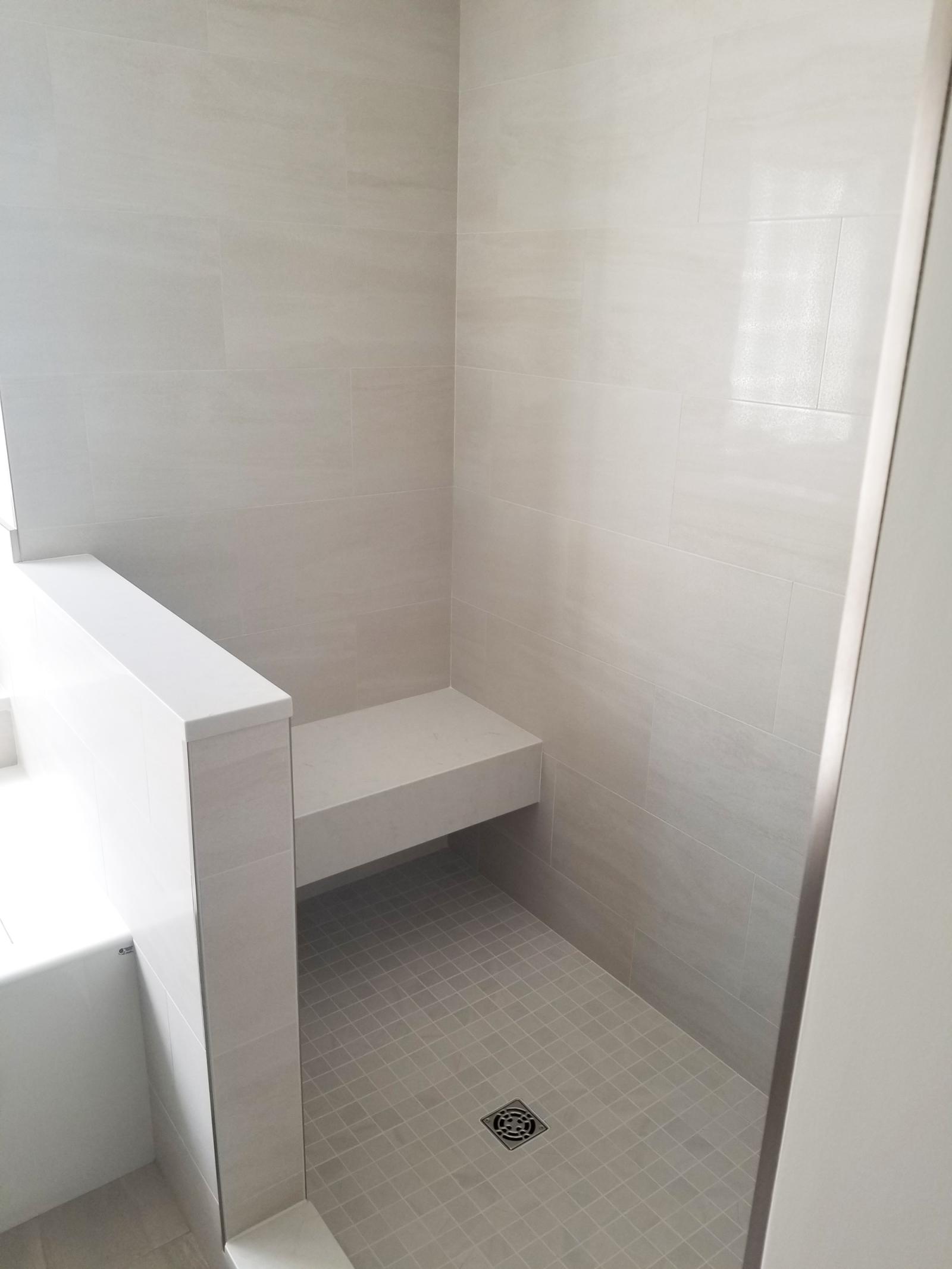 Mixed Tiled Bathroom With Bench